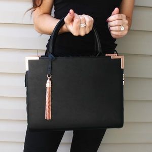 Black purse with rose gold detailing